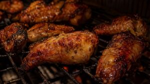 Finished smoked chicken wings with blistered, crackling, deep golden skin