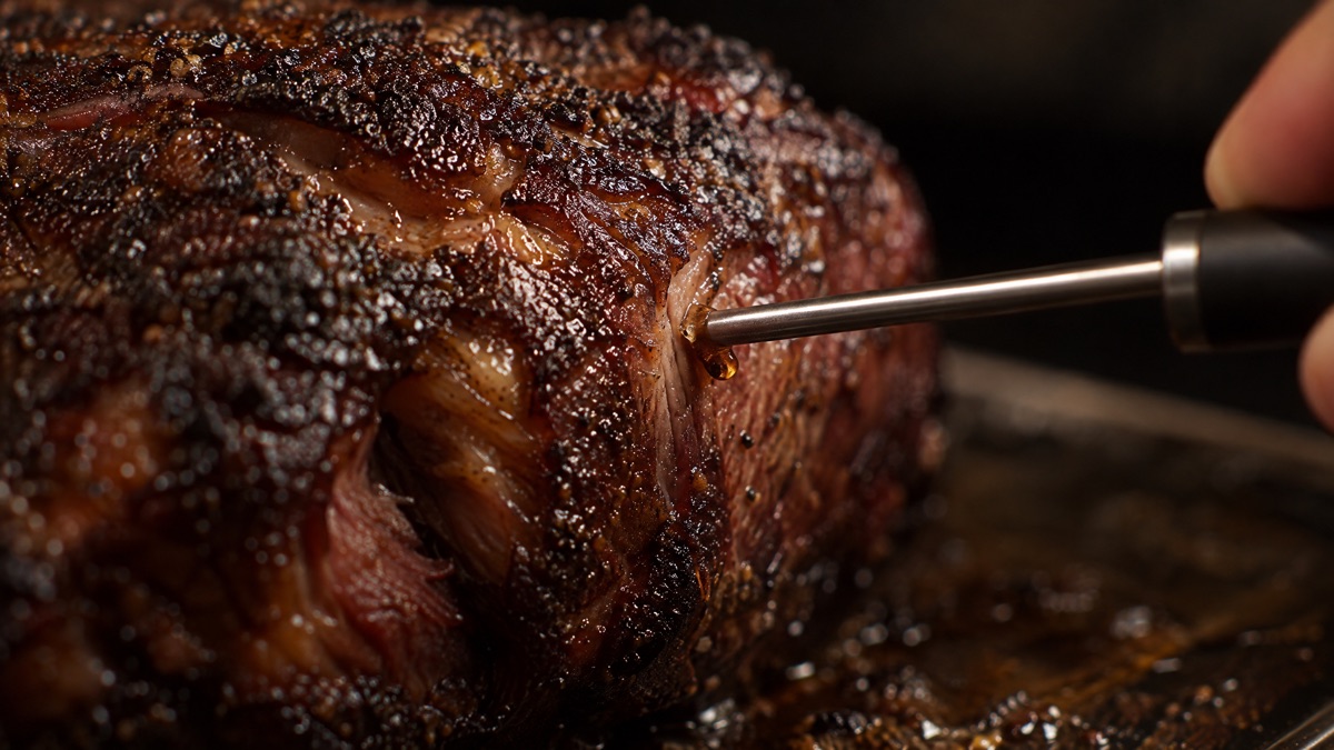 A thin probe sliding into a finished chuck roast with no resistance at all